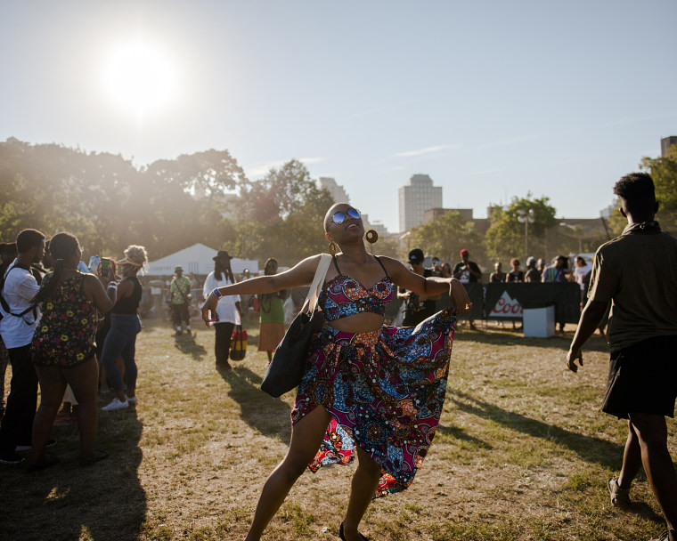 A festival attendee dances to the music at the Afropunk Festival in Brooklyn, NY.