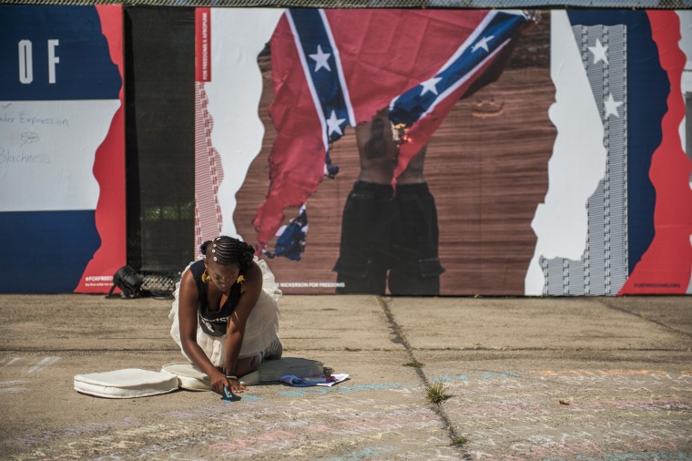 Visual artist Sophia Dawson writes a tribute to those killed by police officers during the 2016 AfroPunk Music Festival at Commodore Barry Park.
The event is a yearly celebration of Afrocentrism, multicultural otherness and experimentation that has closed out the summer months in Brooklyn, N.Y. for the past 11 years. Afropunk has become a palpable force in its own right and is considered the forefront of African-American creativity. The statements featured below are a few opinions on the current state of Black America.