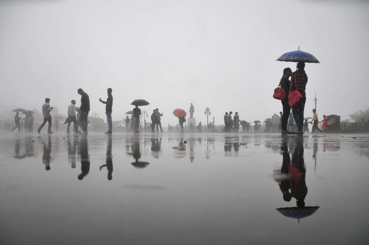 Image: TOPSHOT-INDIA-WEATHER-RAIN
