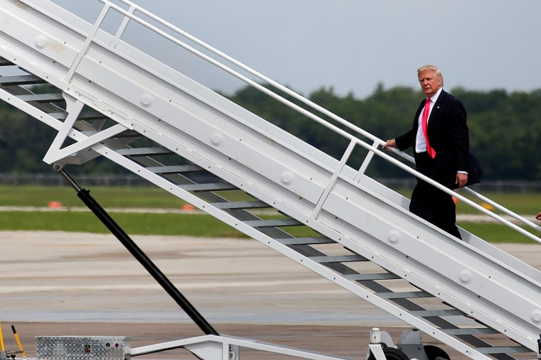 Image: Republican presidential nominee Donald Trump boards his plane following a campaign rally in Tampa
