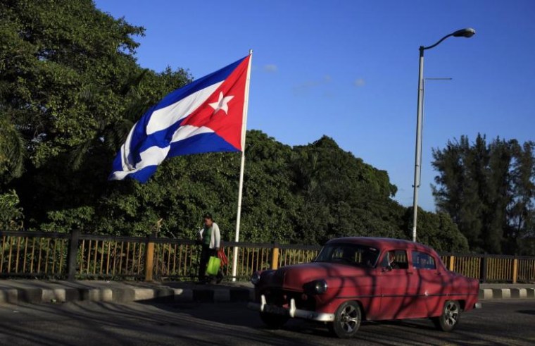 A Cuban flag flies over 'Almendares' bridge in Havana