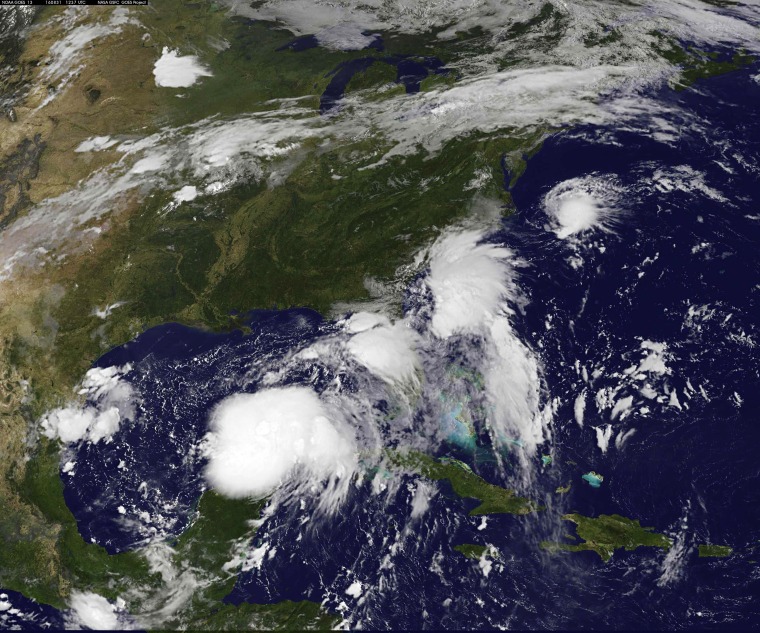Image: Handout photo of satellite image of two tropical depressions over the Gulf of Mexico and along the Carolina coast