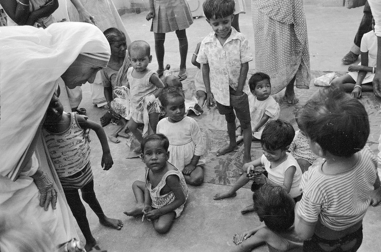 Image: Mother Teresa talks with and blesses orphans in 1979