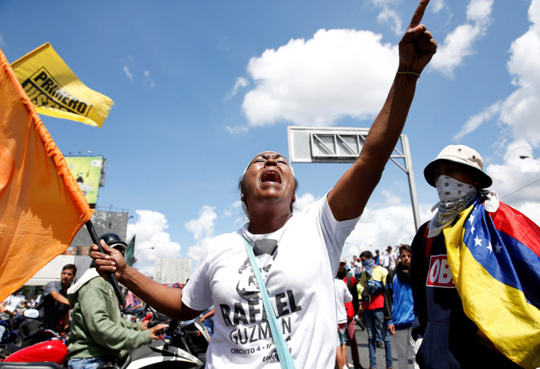 Protesters yell slogans during a rally to demand a referendum to remove Venezuela's President Nicolas Maduro in Caracas, Venezuela