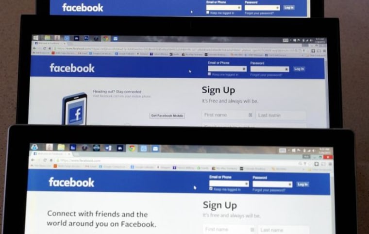 Computer screens display the Facebook sign-in screen in this photo illustration taken in Golden