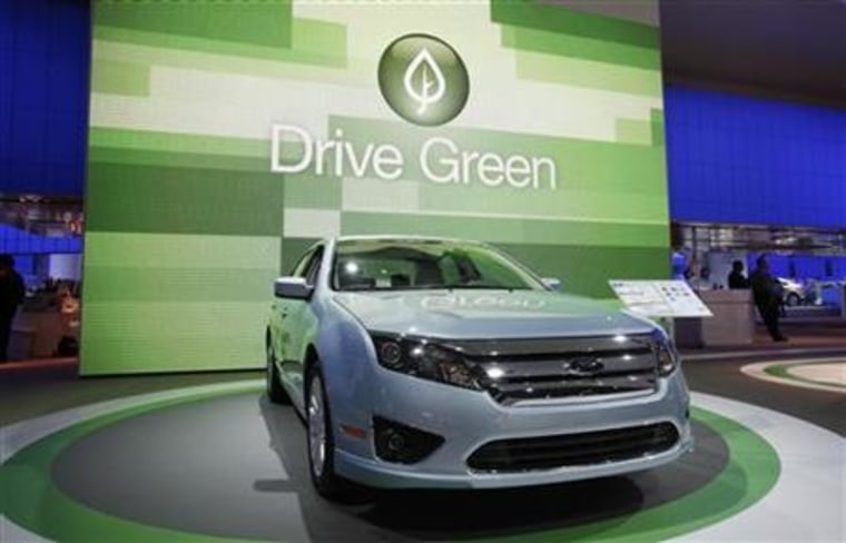 The 2010 Ford Fusion is seen in front of a sign that reads "Drive Green" at the 2010 North American International Auto Show during press days in Detroit, Michigan