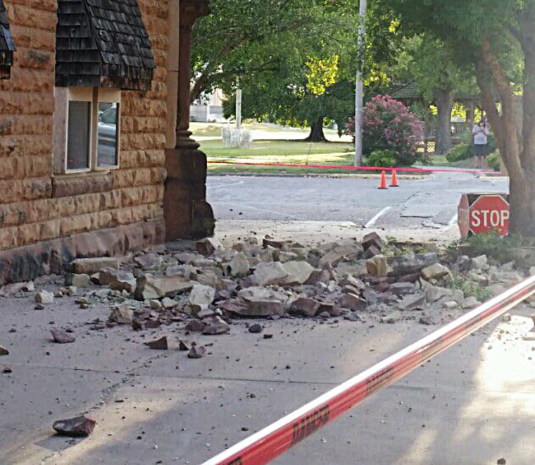 Rubble covers a sidewalk in Pawnee, Oklahoma, after an earthquake.