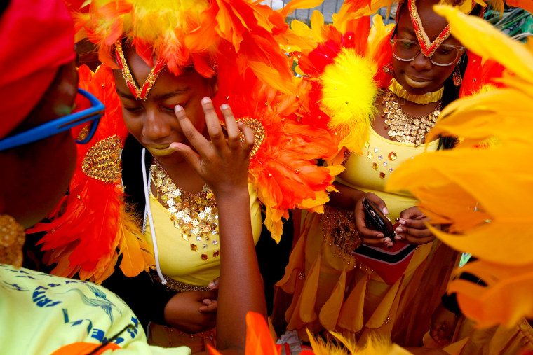 Image: Participants are seen during the West Indian Day Parade in the Brooklyn borough of New York