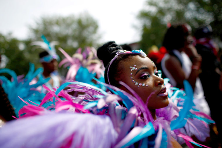 Image: Participants dance during the West Indian Day Parade in the Brooklyn borough of New York