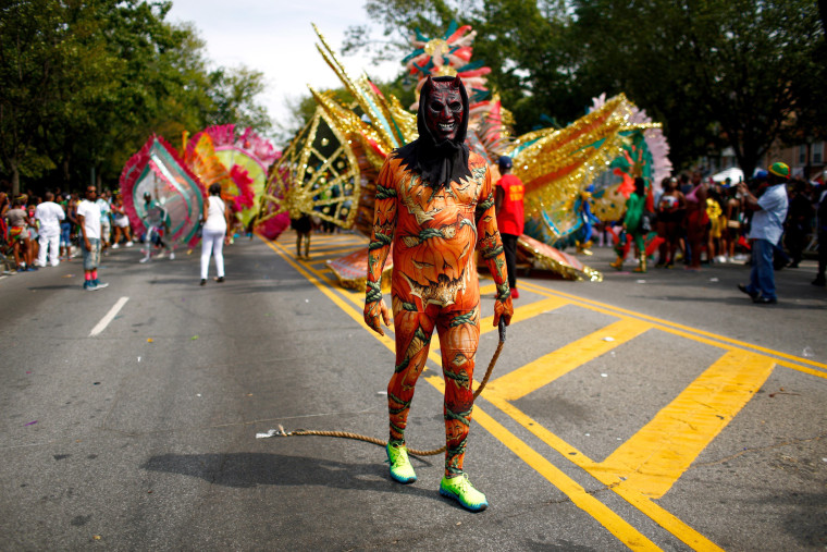 Image: A participant wears a costume during the West Indian Day Parade in the Brooklyn borough of New York