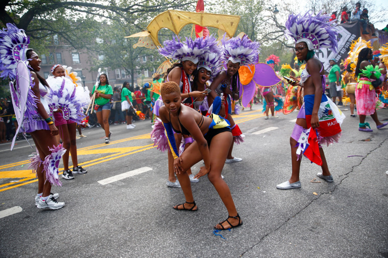 Image: Participants dance during the West Indian Day Parade in the Brooklyn borough of New York