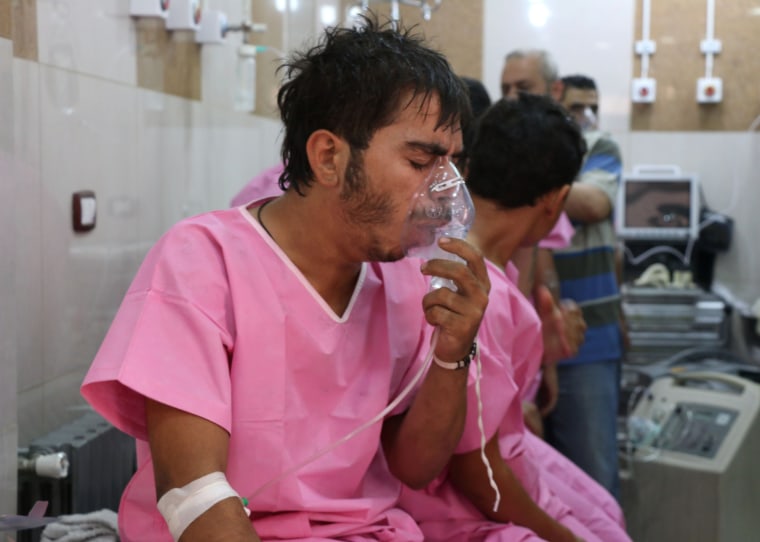 Image: A Syrian man suffering from breathing difficulties is treated at a make-shift hospital in Aleppo, Tuesday.