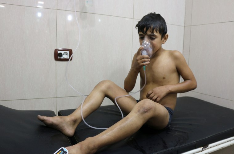 Image: A Syrian boy suffering from breathing difficulties is treated at a make-shift hospital in Aleppo, Tuesday.