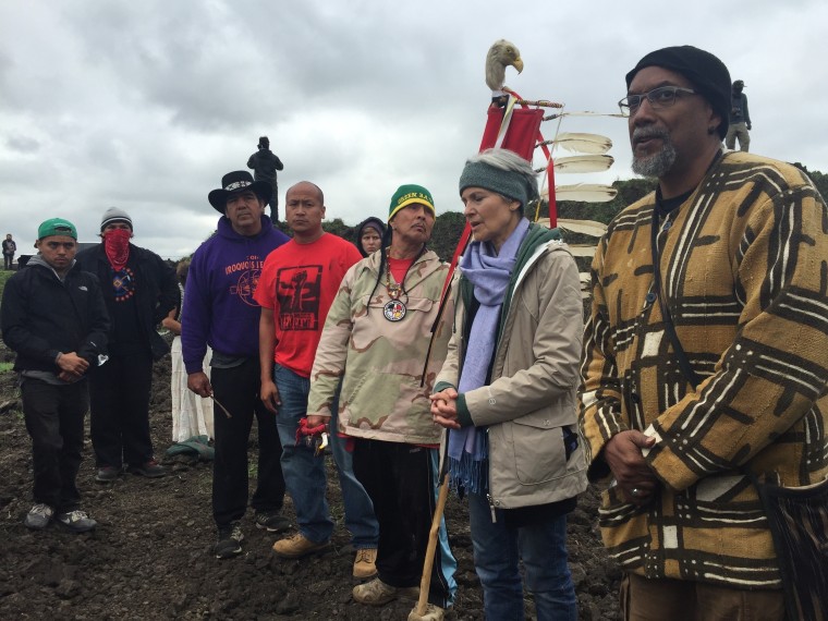 In this photo provided by LaDonna Allard, Green Party presidential candidate Jill Stein, second from right, participates in an oil pipeline protest, Tuesday, Sept. 6, 2016 in Morton County, North Dakota