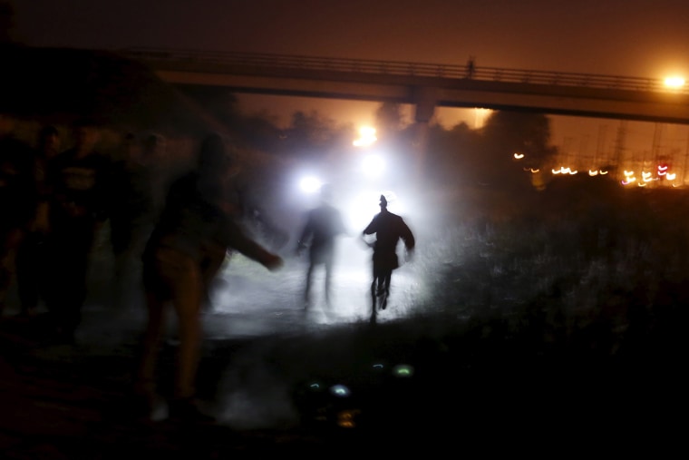 Image: Migrants attempt to access the Channel Tunnel