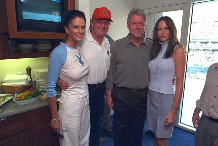 President Clinton poses with Donald Trump, Melania Knauss, right, Trump's future wife, and an unidentified woman at the U.S. Open Tennis Championship match in New York on on Sept. 8, 2000.