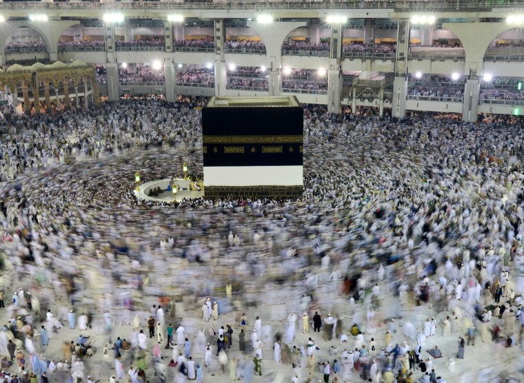 Image: Muslim pilgrims circle the Kaaba at the Grand mosque in Mecca