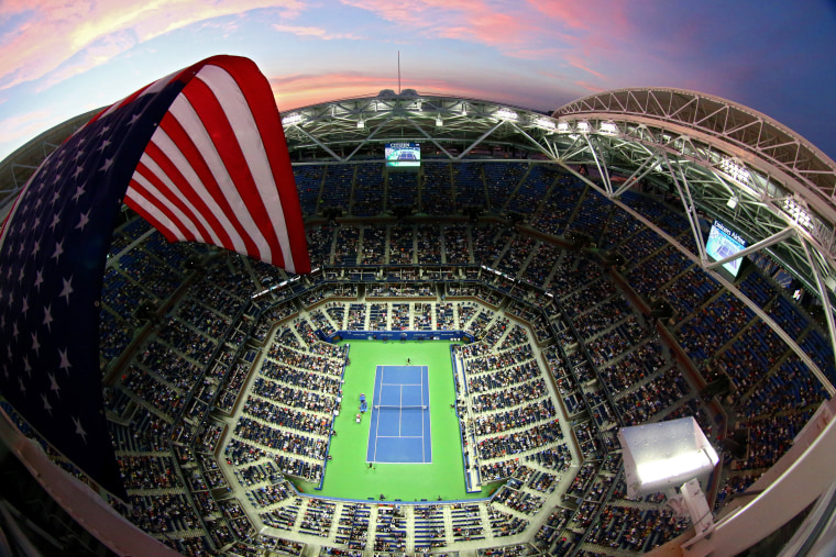 Image: An American flag flies over Arthur Ashe Stadium