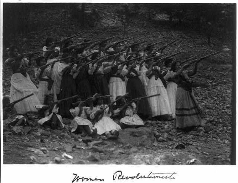 Photo of Soldaderas holding rifles.