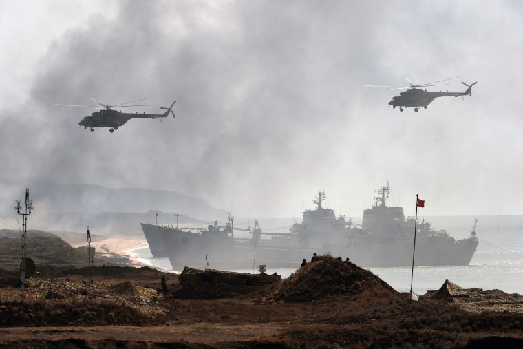 Image: Russia's navy ships and helicopters take part in a military exercise in Crimea.