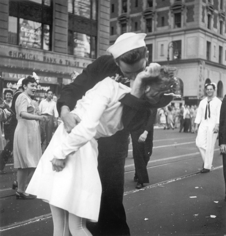 In this photo provided by the U.S. Navy, a sailor and a nurse kiss passionately in Manhattan's Times Square, as New York City celebrates the end of World War II, on August 14, 1945.