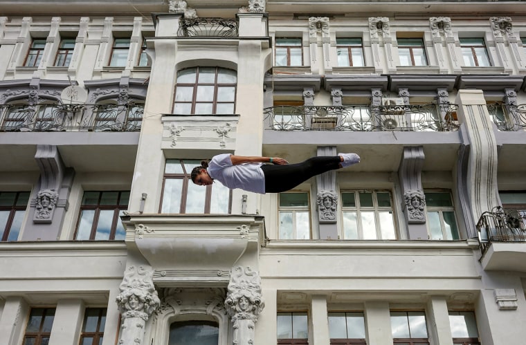 Image: A gymnast performs on a street during the celebrations for the City Day in Moscow