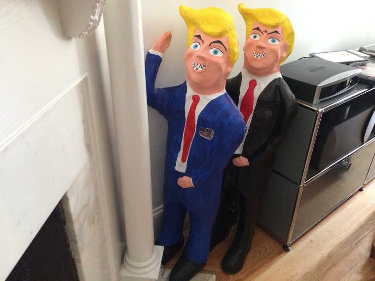 Trump piñatas are pushed to a corner during a brunch for Latinas who support Hillary Clinton held Sept. 10, 2016.
