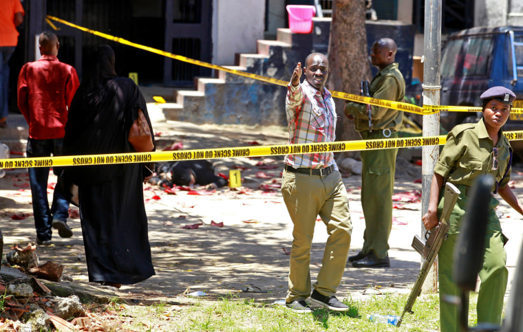Image: Police officers and explosive experts secure the central police station after an attack, in the coastal city of Mombasa