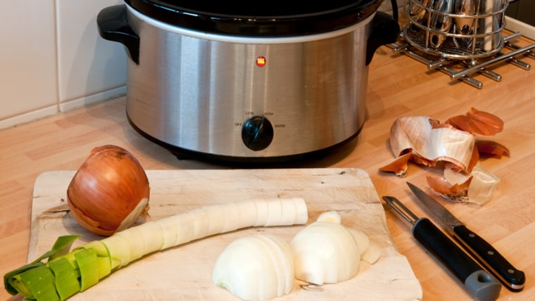 Slow cooker with chopping board