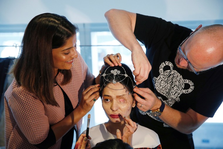 Image: Indian model and acid attack survivor Reshma Quereshi has make up applied before walking to present Indian designer Archana Kochhar's Spring/Summer 2017 collections during New York Fashion Week in the Manhattan borough of New York