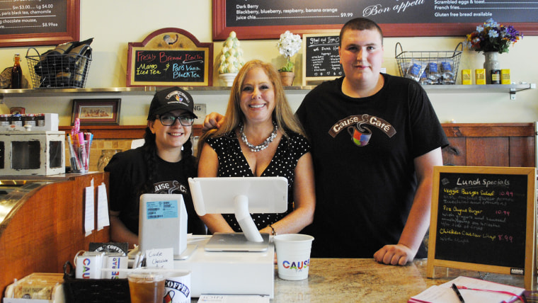 Stacey Wohl with some of her employees behind the counter at Cause Caf?.