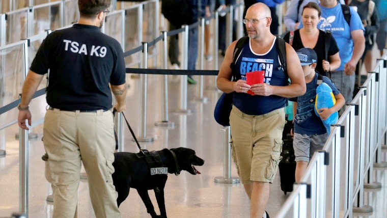 TSA security officer and dog