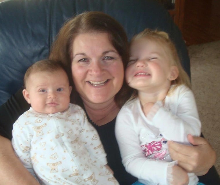 Lori with two of her four grandchildren.
