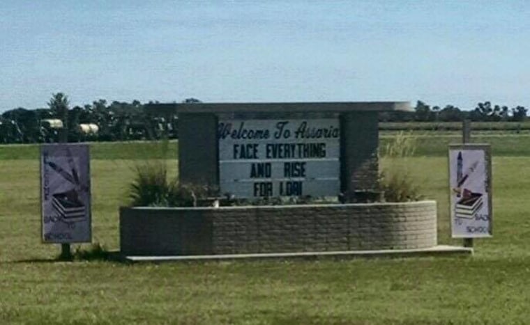 A sign outside of Lori’s hometown of Assaria, Kansas.