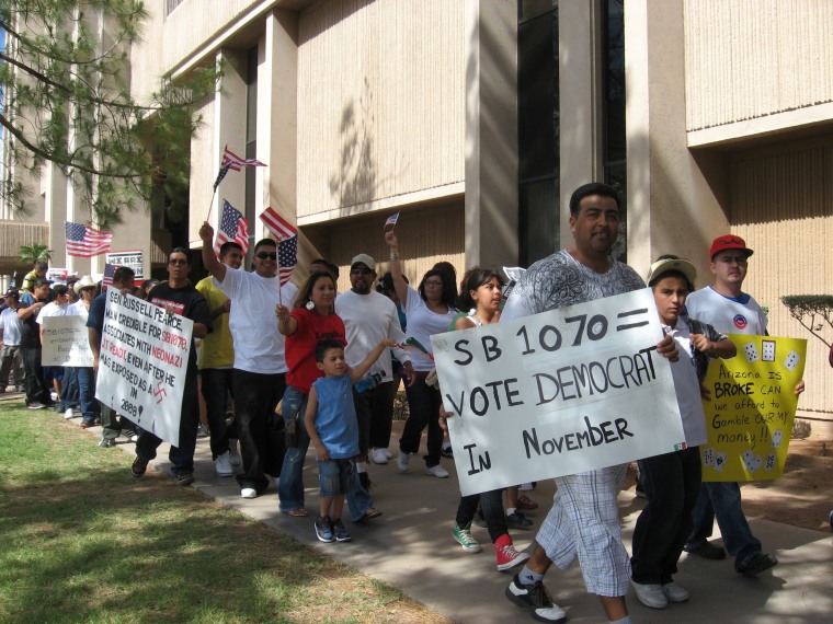 Students walked out of high school to protest the signing of SB 1070 into law at the Arizona State Capital in 2010.