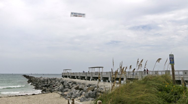 Image: An aerial banner is flown over the South Pointe Park pier