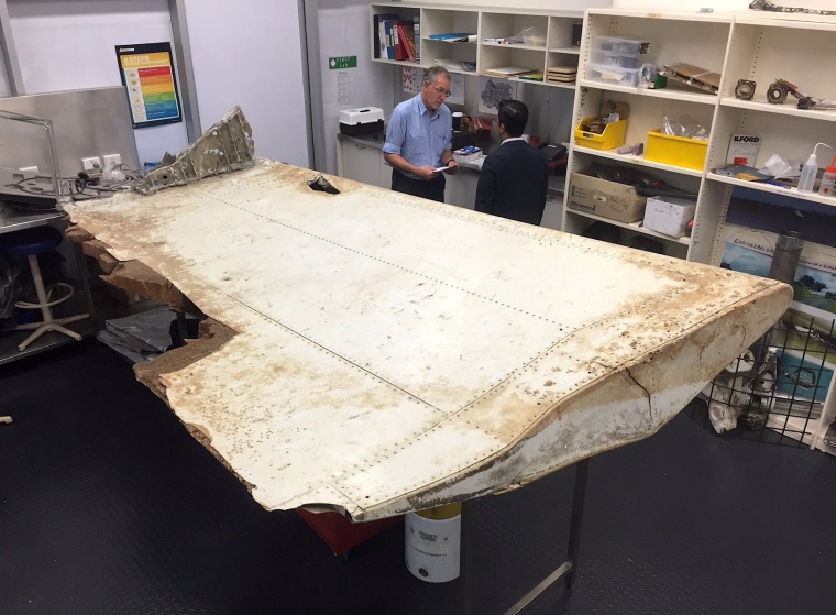 Image: Australian and Malaysian officials examine the debris on July 20, 2016