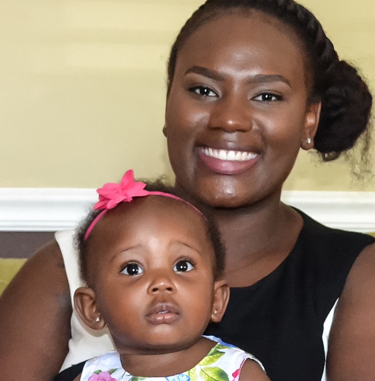 Kamaria Downs, shown here with her daughter, Ryann, was kicked off campus when Claflin College learned she was pregnant.