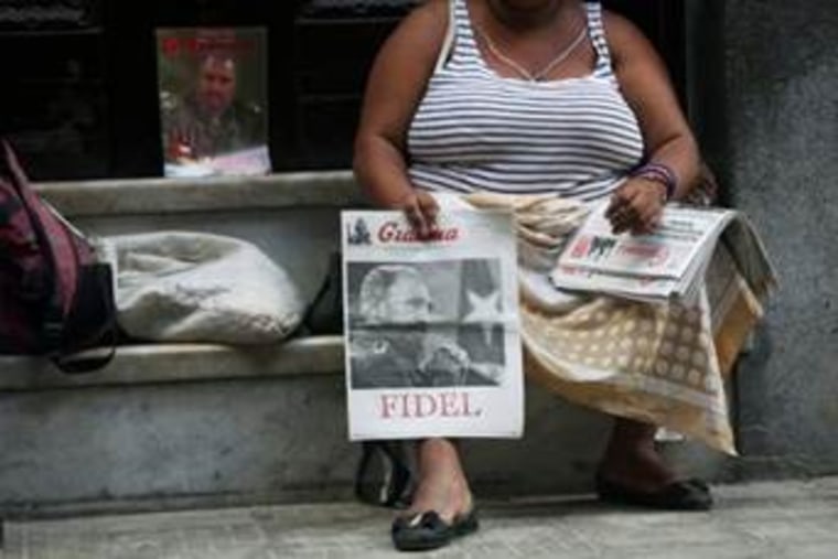 A woman sells copies of Granma, the official newspaper of the Cuban Communist Party (PCC), featuring a front page picture of former Cuban President Fidel Castro, in Havana on Sept. 14.
