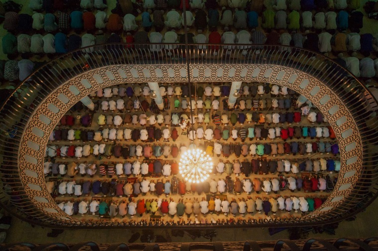 Image: Bangladeshi Muslims attend Eid al-Adha prayers at Baitul Mukarrom National Mosque