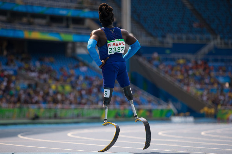 Image: Regas Woods, of the United States, looks on after competing in round 1 of the men's 100-meter T42 athletics event