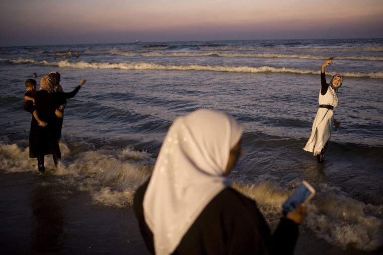 Image: Palestinians spend the day on the beach during the Muslim Eid al-Adha holiday