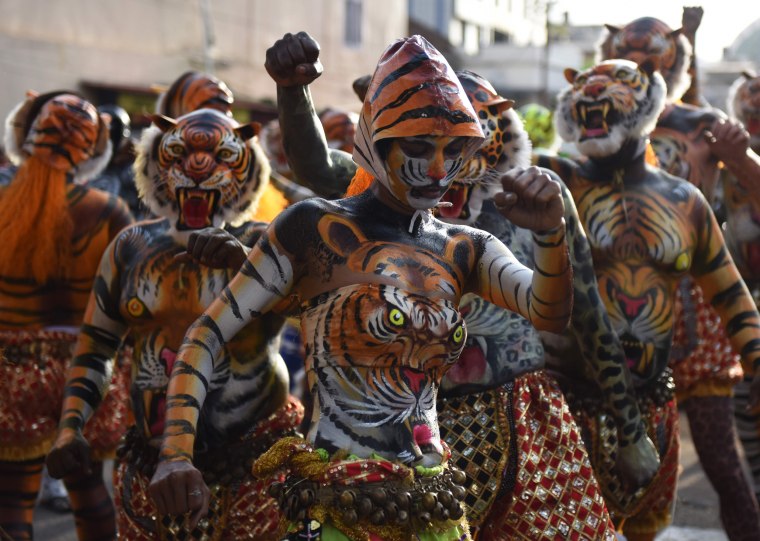 Image: TOPSHOT-INDIA-FESTIVAL-PULIKALI