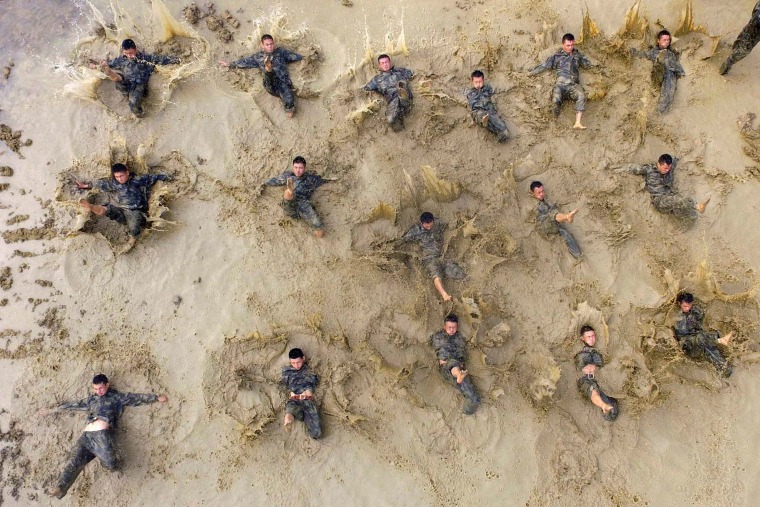 Image: Paramilitary policemen take part in a drill in Baise