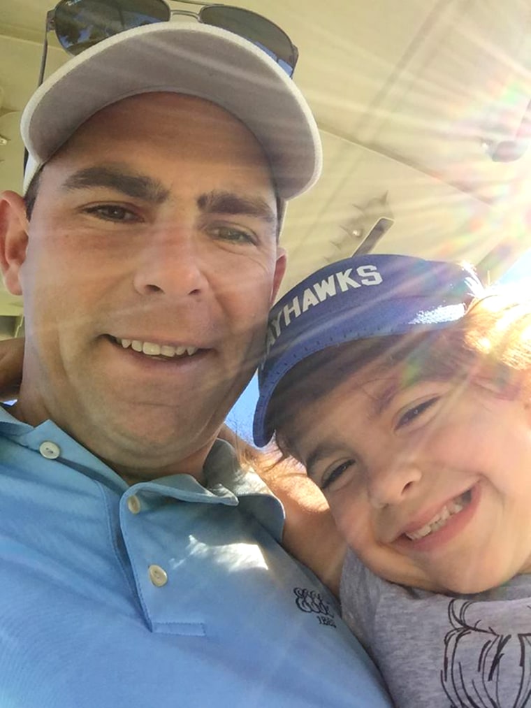 Ella golfing with her dad, Eddie Scott, on a sunny day.