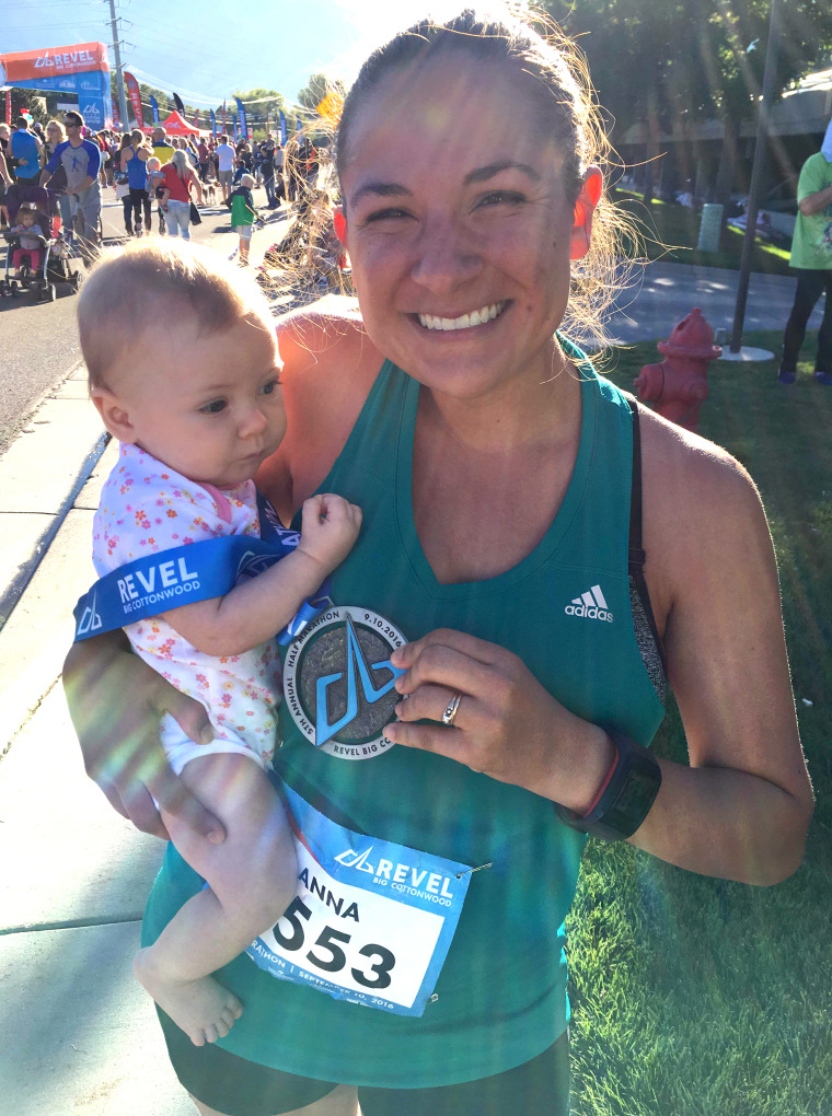Anna Young holds her daughter after running a half marathon.