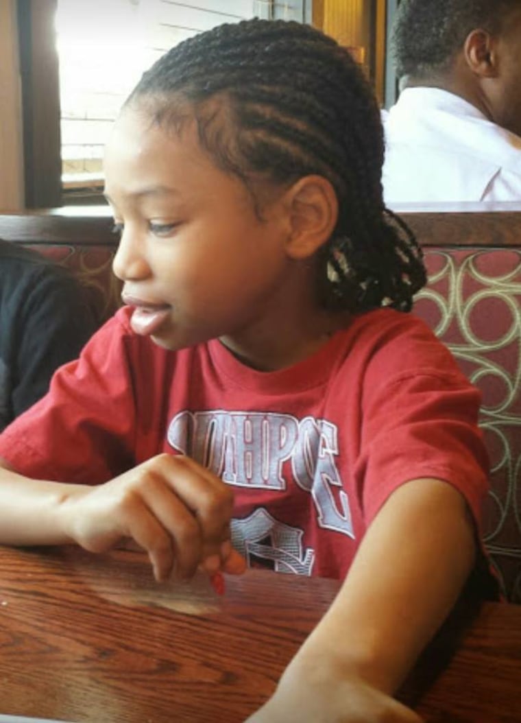 Thomas Moore with hair braided in cornrows Boy grows hair for 2 years to help kids with cancer