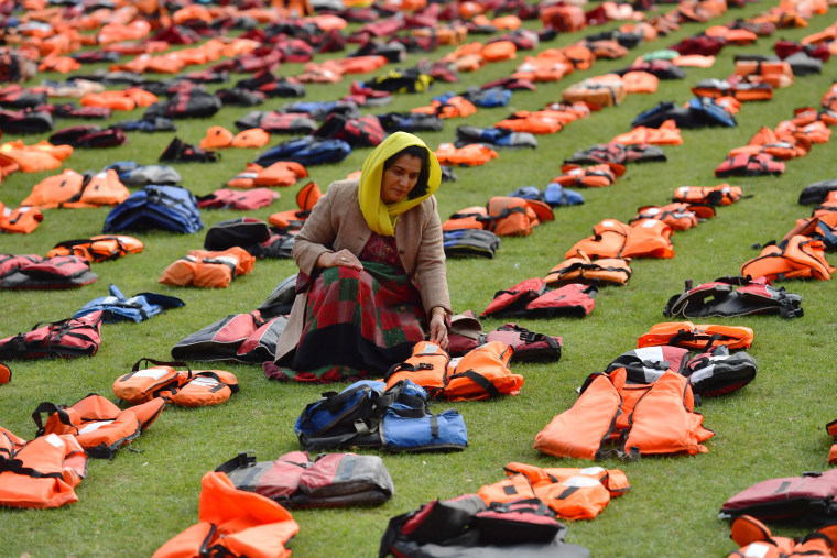 Image: Rahela Sidiqi, a trustee of Women for Refugee Women and originally from Afghanistan, views the life jackets