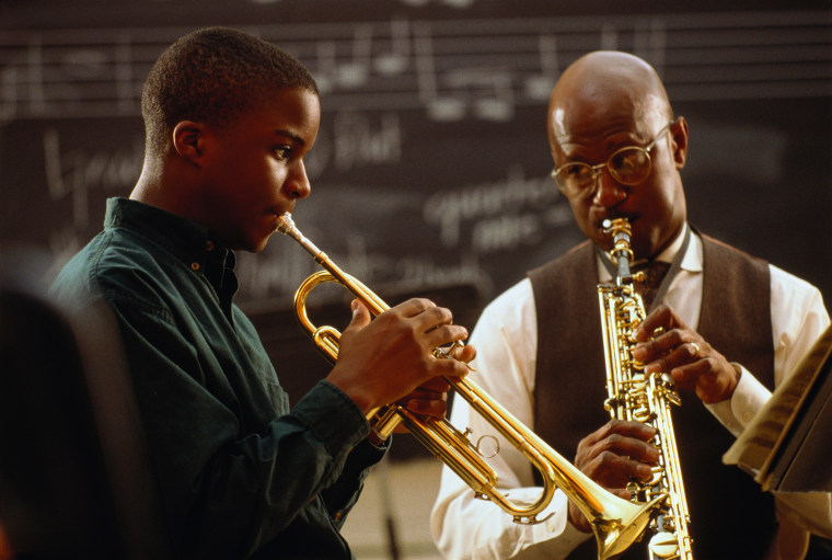 Image: Music teacher performing with student