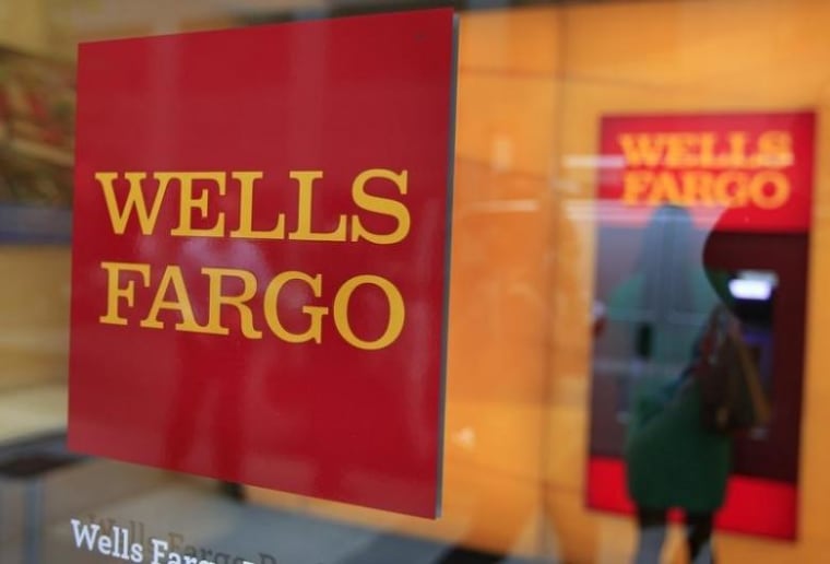 A Wells Fargo sign is seen outside a banking branch in New York